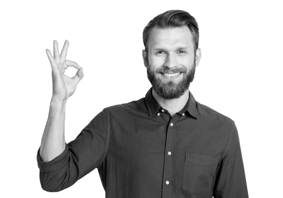 A man smiling, holding his hand in an ok sign.
