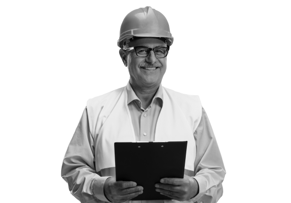 Man in construction uniform smiling and holding a clipboard.