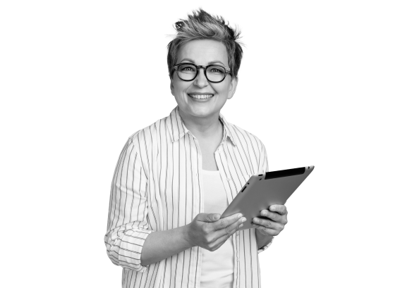 A lady with glasses smiling, holding a tablet.
