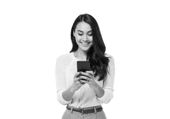 A lady smiling looking at her phone, after working securely from anywhere.