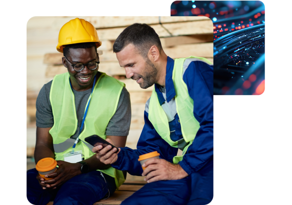 a man wearing a hard hat and a high vis next to a man also wearing a hi vis showing him People First recruitment software on his phone.