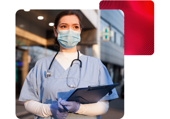 Portrait of a female A&E worker with a medical mask and stethoscope outside a hospital