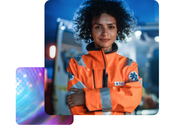 Portrait of a female ambulance worker pictured in front of her vehicle