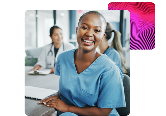 Portrait of a female healthcare worker smiling during a team meeting