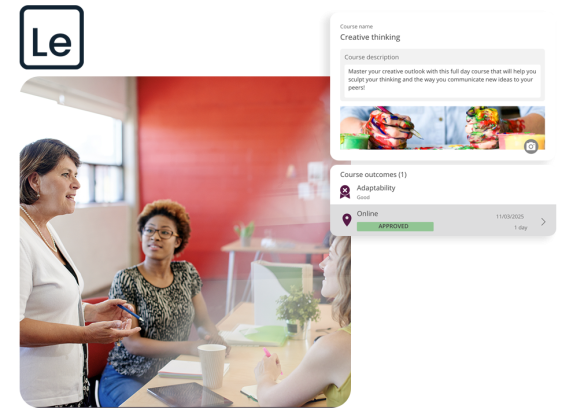 Three women collaborating in an office environment in front of a red wall