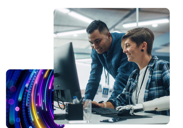 a lady working on a computer, with a man leaning over the table both working with Payroll Software.