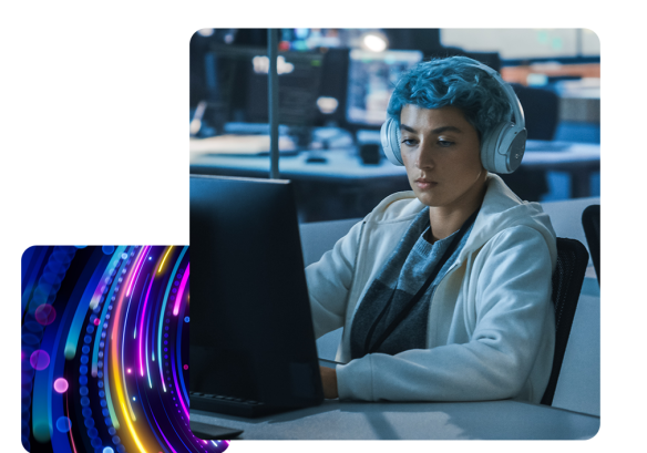 A lady working on a desktop, wearing headphones.