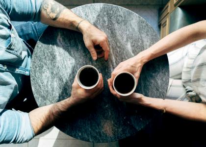 Top view of two people having coffee