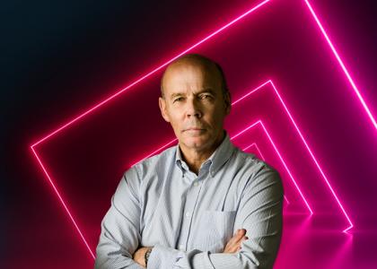 sir clive woodward with neon pink squares on black background