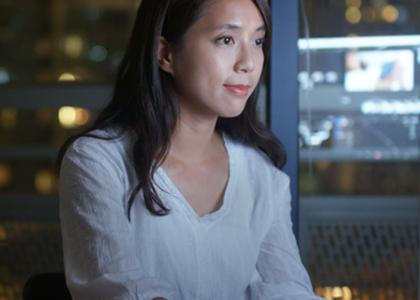 woman in front of screen at home