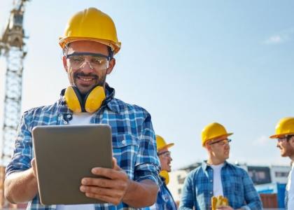 Construction worker on tablet