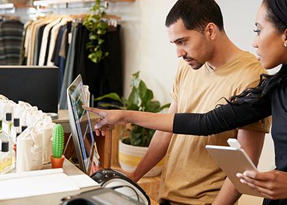 Retail worker learning the systems