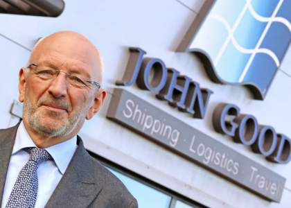 Stewart Oades, chairman of John Good Group, standing in front of the company building.