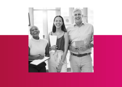 Three people with notebooks, laughing. Representing a good, healthy company culture.