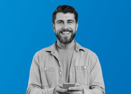 a man on his phone smiling