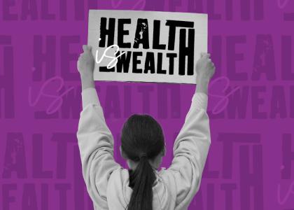 a lady holding up a banner, 'health is wealth'.