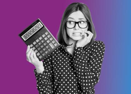 a lady holding a calculator worried