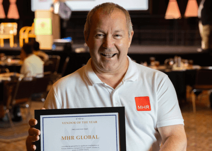 Andy Davies, Head of Global Partnerships at MHR holding the Vendor of the Year award from SHRM Georgia State Council