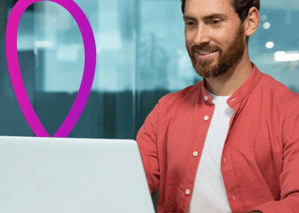 Image of a man working on a laptop. 