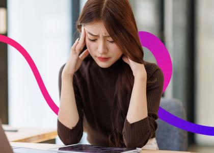 A lady with her head in her hands.