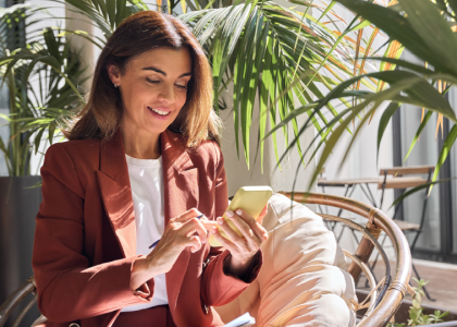 business woman looking at her smartphone