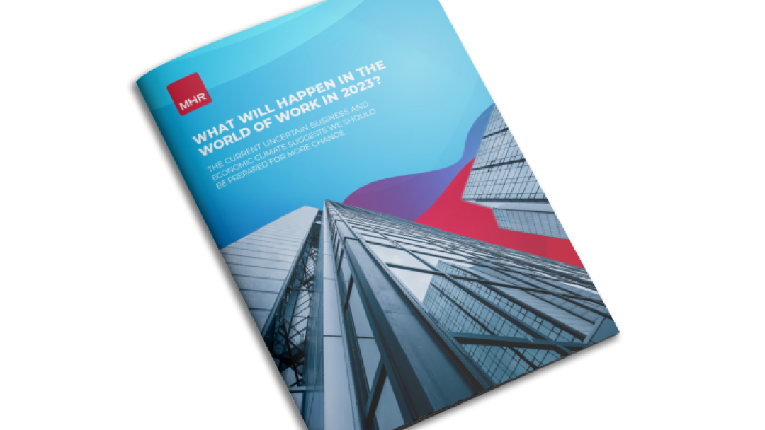 Business Predictions Report 2023 front cover image containing tall glass buildings.