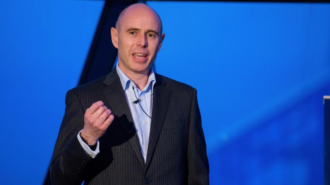 Neil Martin on stage as a keynote speaker