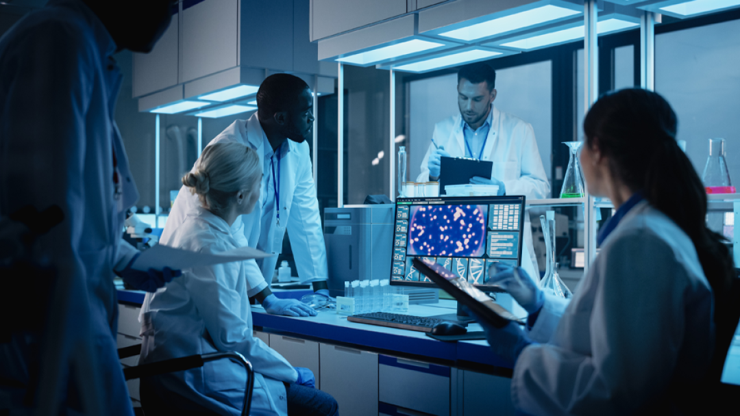 Scientists sat in lab coats researching technology