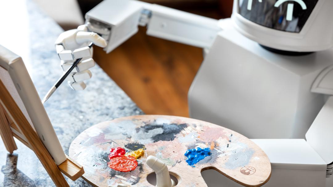 Robot pictured with an easel and paint palette, painting a picture representing AI art