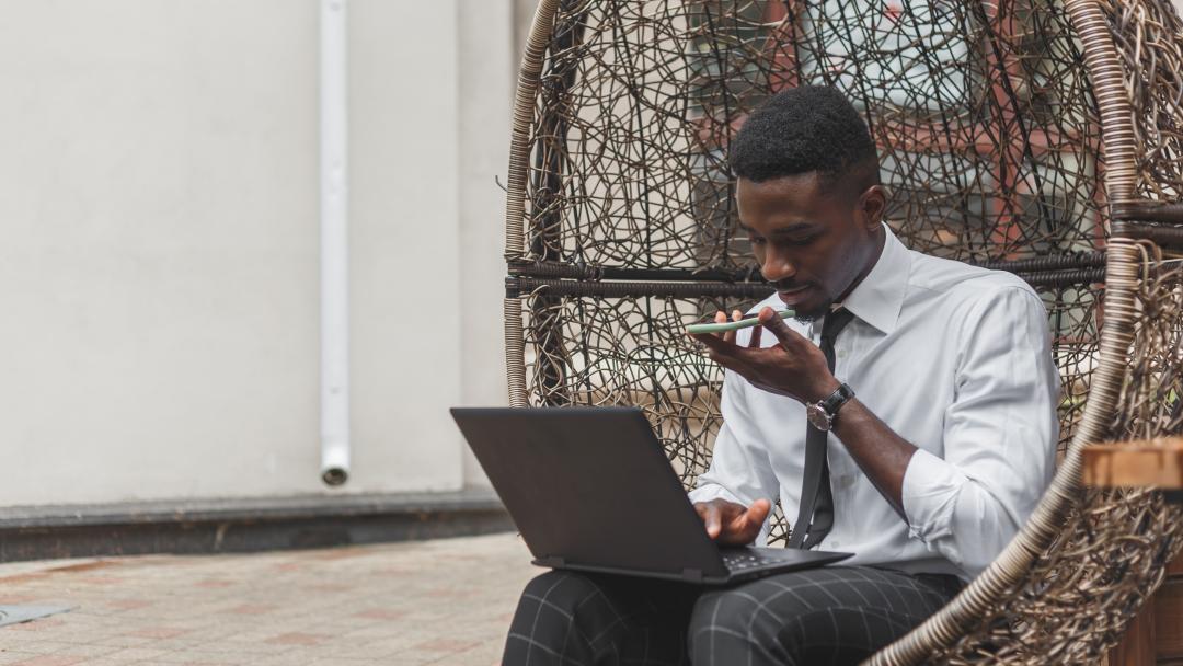 Man speaking into a mobile phone