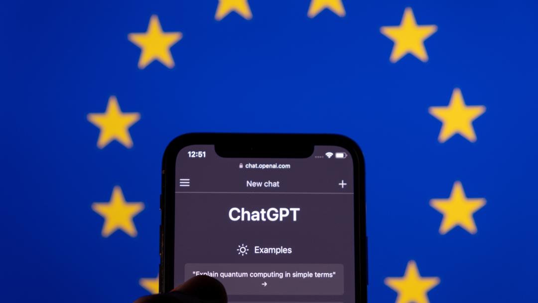 EU stars behind a mobile with chatGPT displaying on the screen.