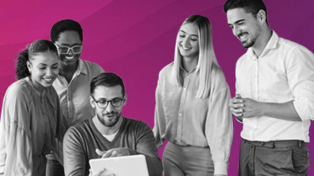 People smiling around a tablet looking happy that their business processes are automated.