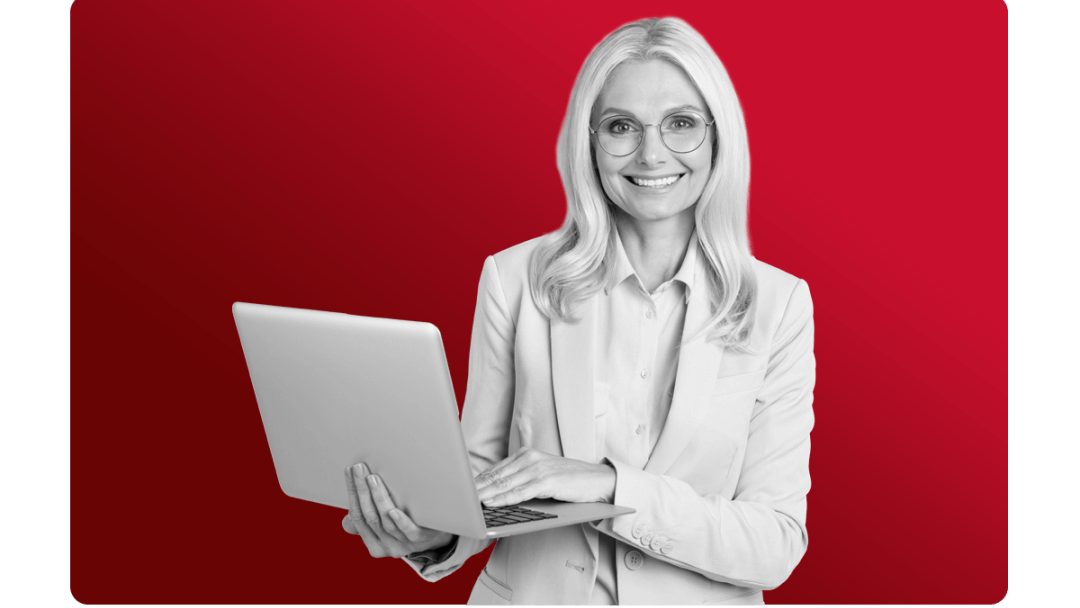 Woman smiling at her laptop after all our reporting can be seen in real time.