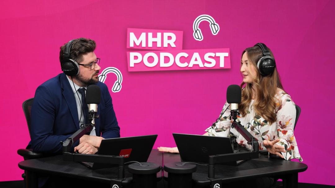 Andy and Alice sat with MHR podcast displaying behind them.