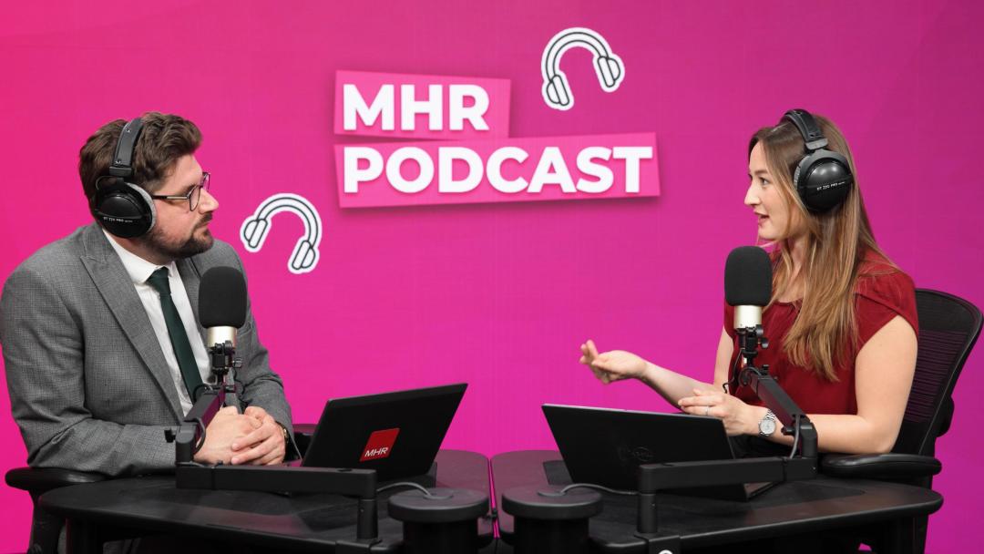 Andy and Alice with MHR Podcast behind them.
