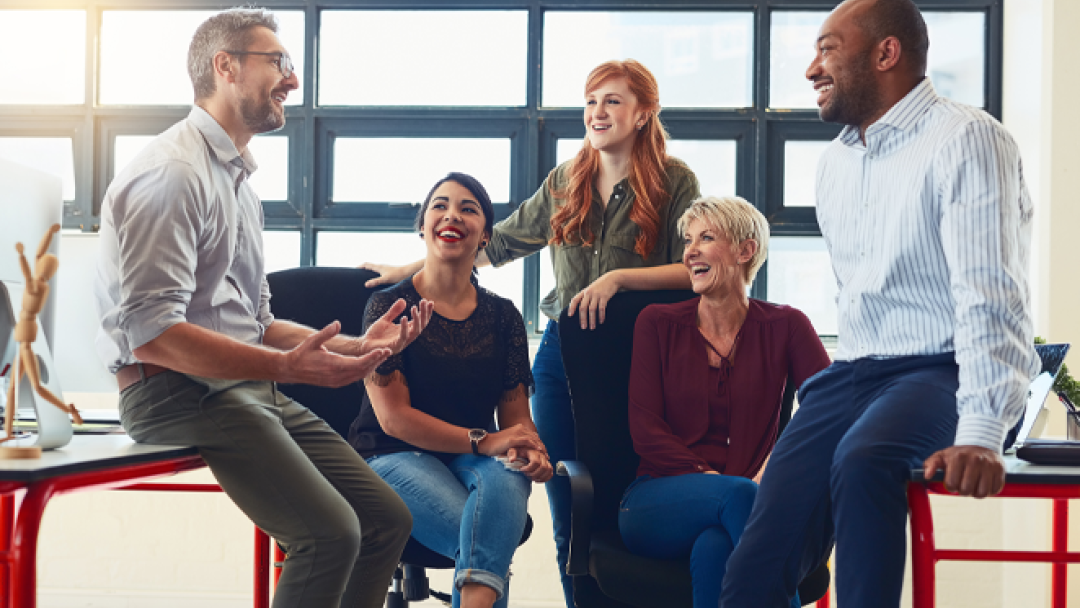 Five people sat around having a chat about the importance of eqaulity.