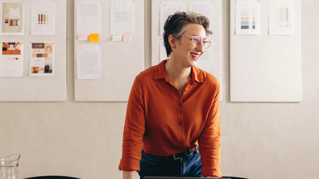 a person smiling in an office