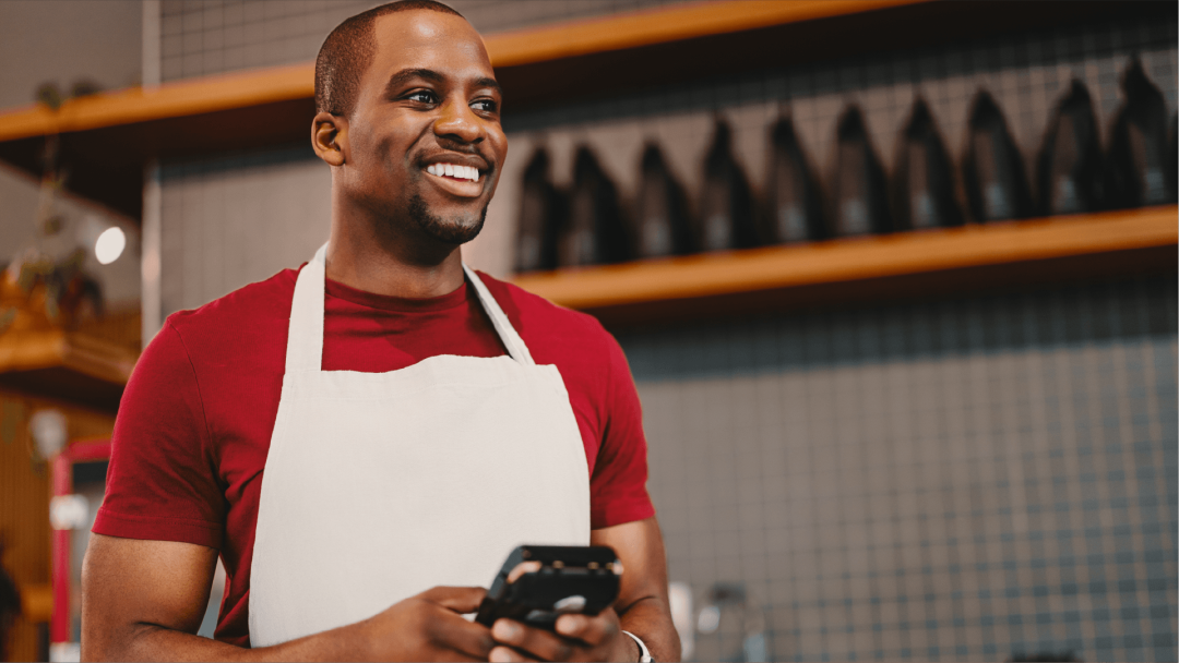 Employee using a mobile device while working in a retail environment