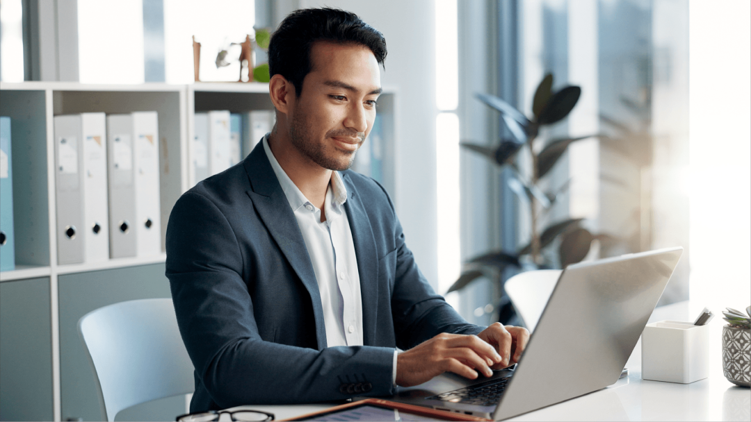 Business professional working on a laptop in an office