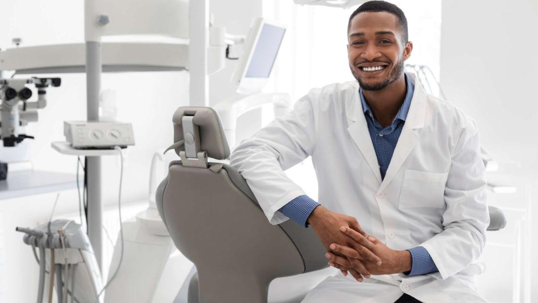 Dentist in white coat