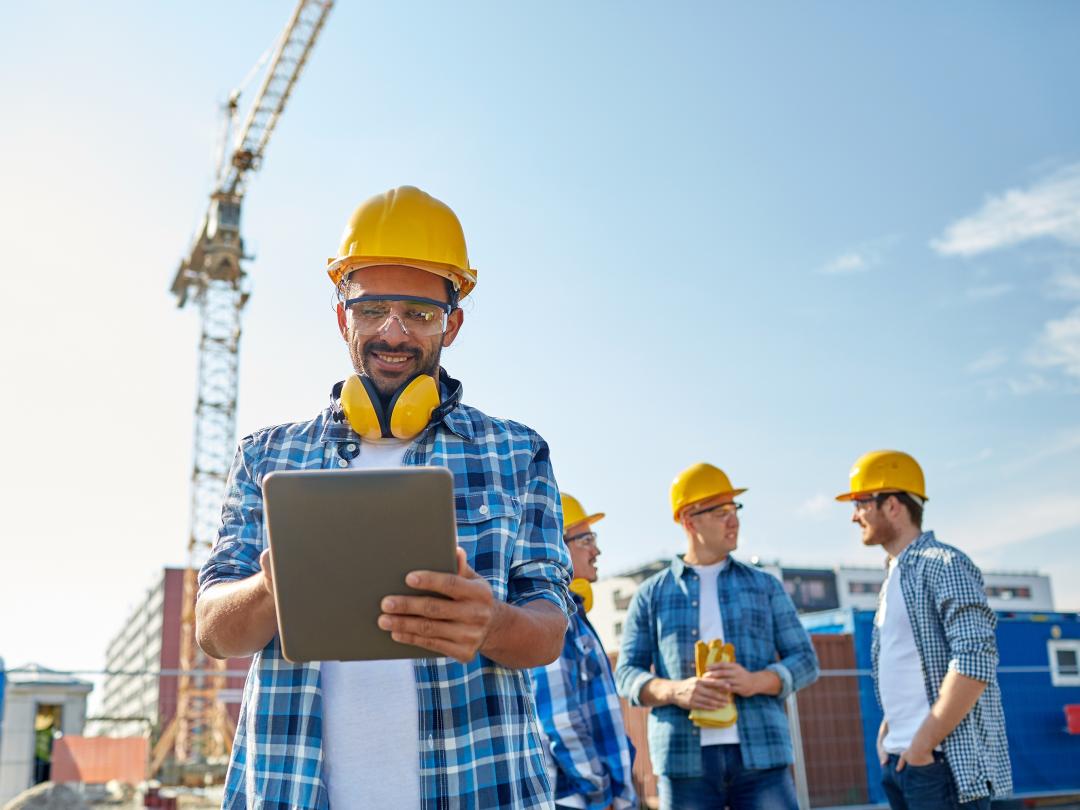 Construction worker on tablet