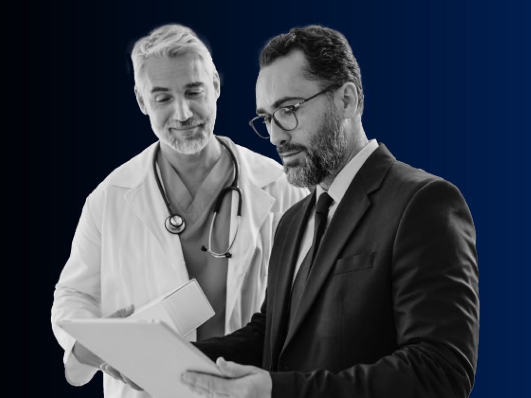 a doctor talking to someone in a suit holding an ipad.