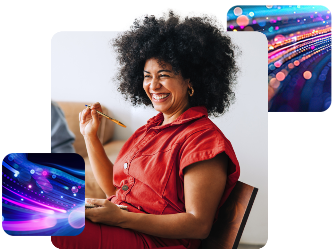 A lady sat laughing with a pen and note pad in her hands, talking about integrated lxp into their People First platform.
