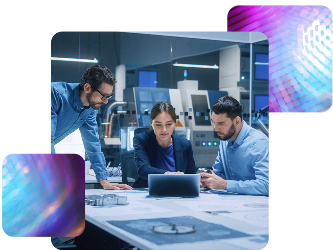 three people sat round a table working on a laptop, managing their HR and payroll through MHR's software.