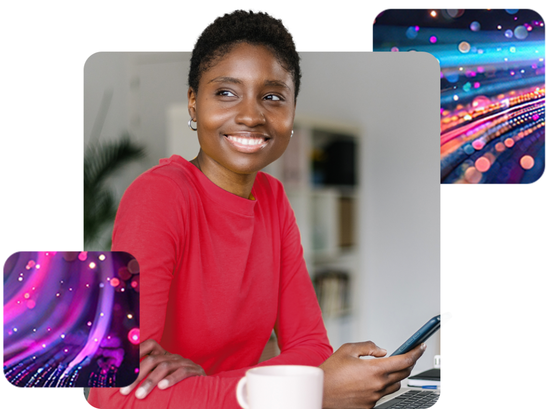 A lady sitting with a mobile in her hand, and a coffee cup next to her smiling about outsourcing her payroll through MHR.