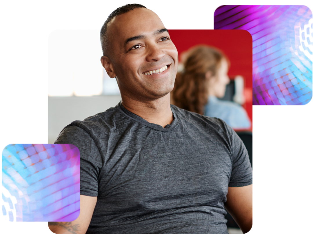 a man sat smiling, happy after using recruitment and onboarding software through MHR.