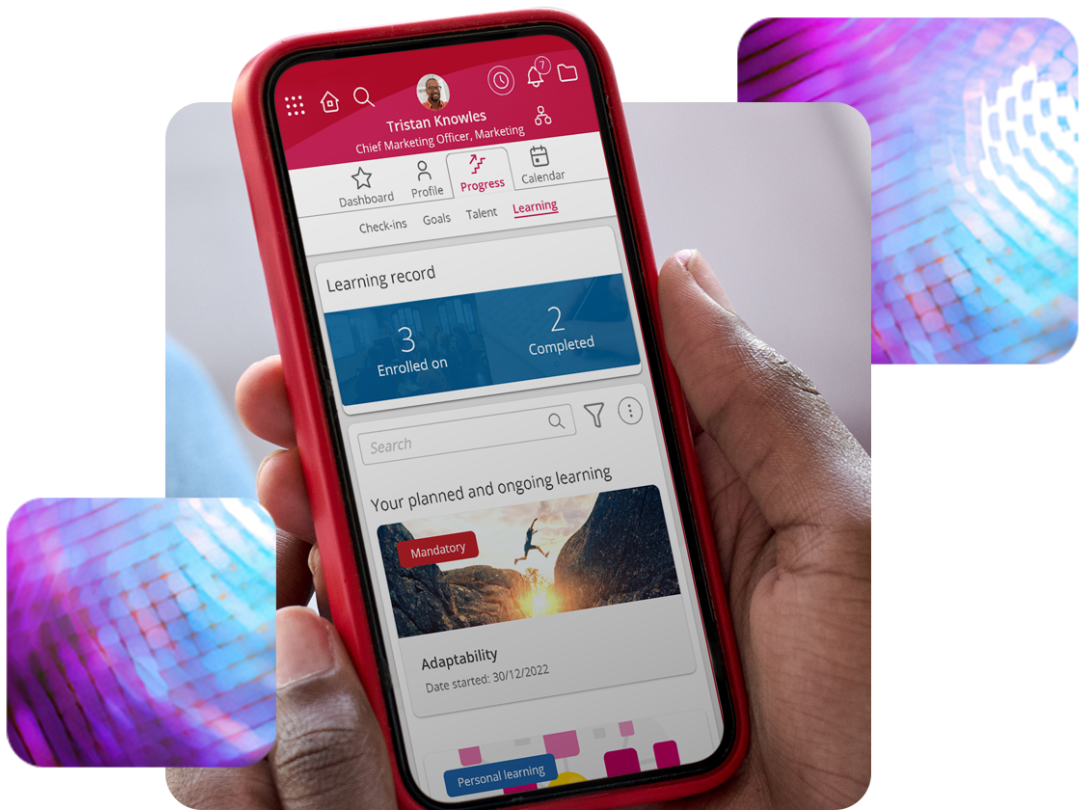 Someone holding a mobile looking at their progress through MHR's learning software.