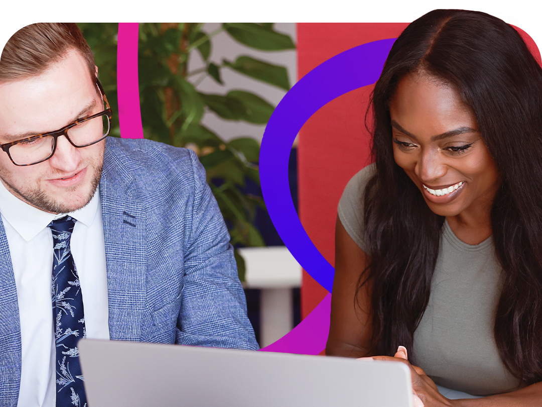 A man and woman are working on a laptop
