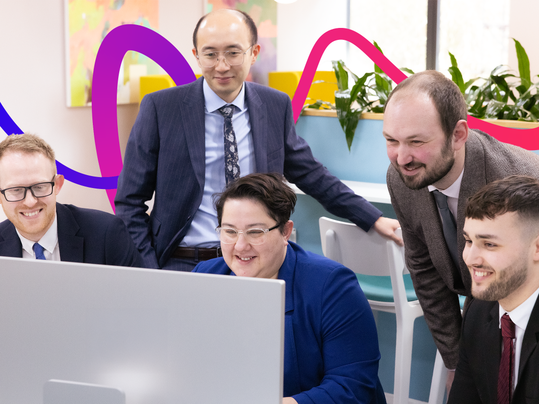 The team are looking at the computer screen 