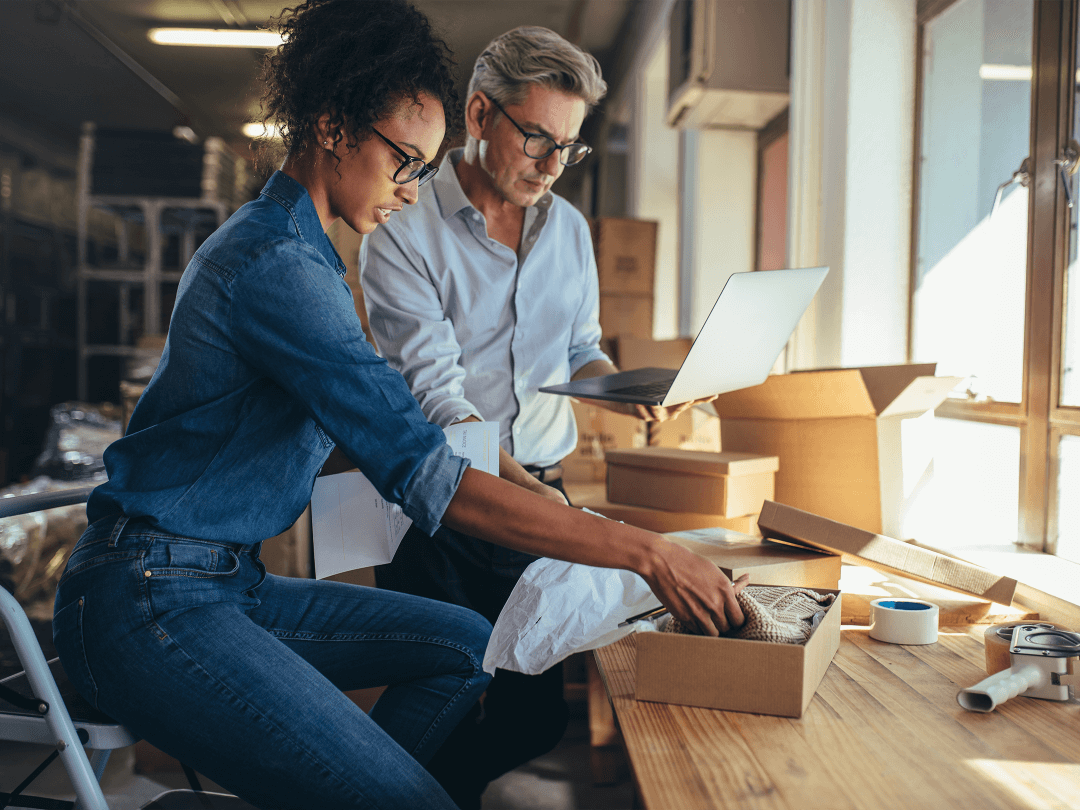 man and a woman boxing merchandise